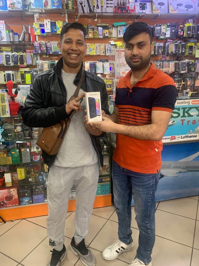 A customer collecting a new phone